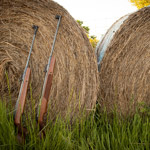 RWS Rifles leaning against hay bale