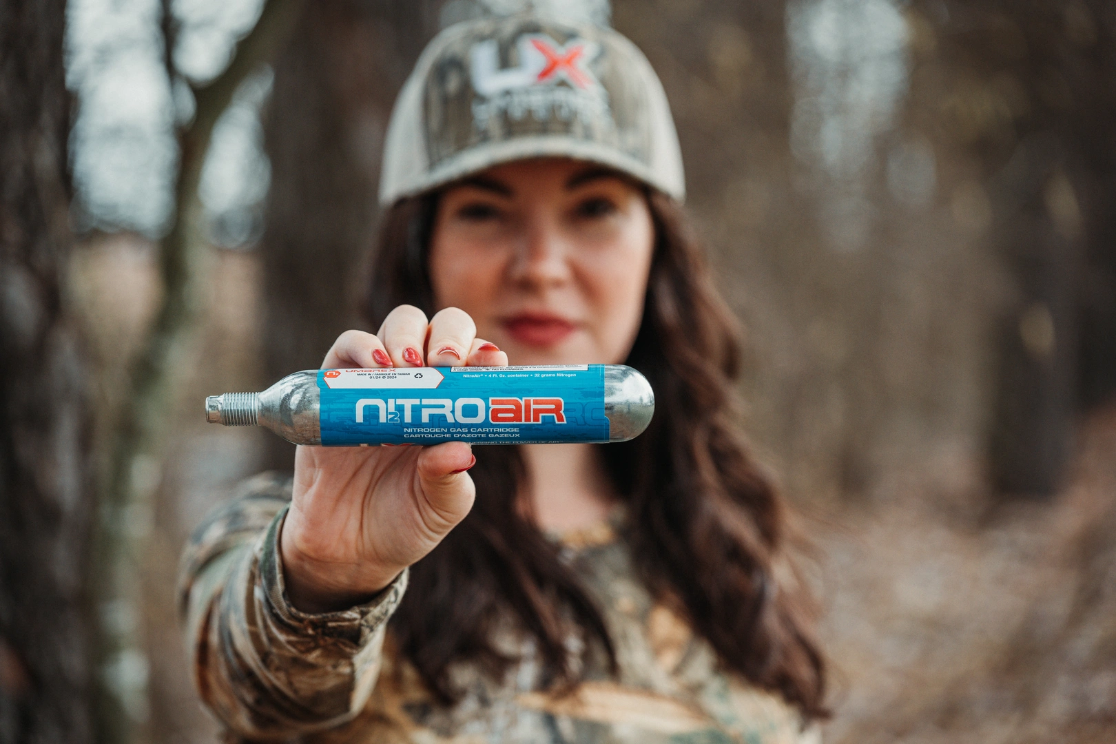 NitroAir cartridge held by an attractive female model